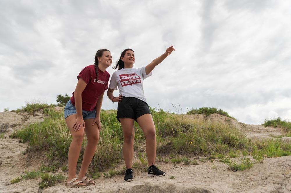 Two students hiking on C-Hill